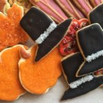 Decorated Thanksgiving cookies of pumpkins, leaves and black pilgrim hats