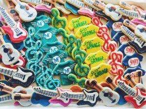Platter of decorated cookies including guitars, treble clefs and band t-shirts