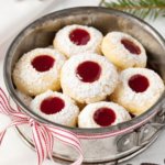 Raspberry thumbprint cookies in a silver tin that inspired a home cookie business