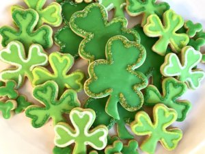 Platter of green decorated shamrock cookies