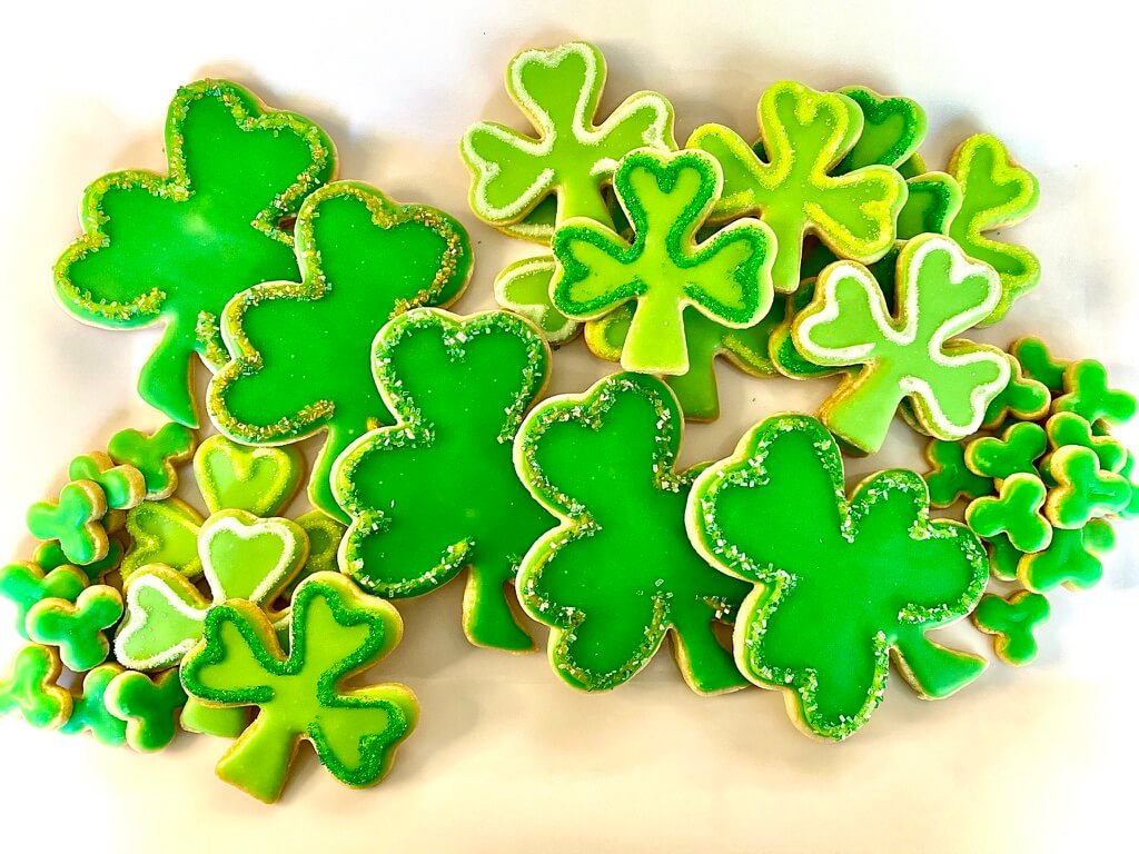 Platter of green decorated shamrock cookies for Saint Patrick's Day